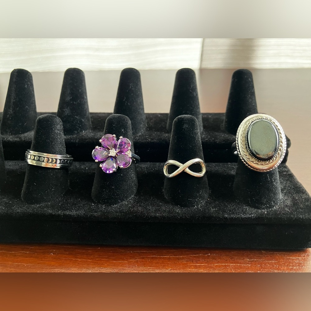 Lot of 4 costume jewelry silver tone rings.